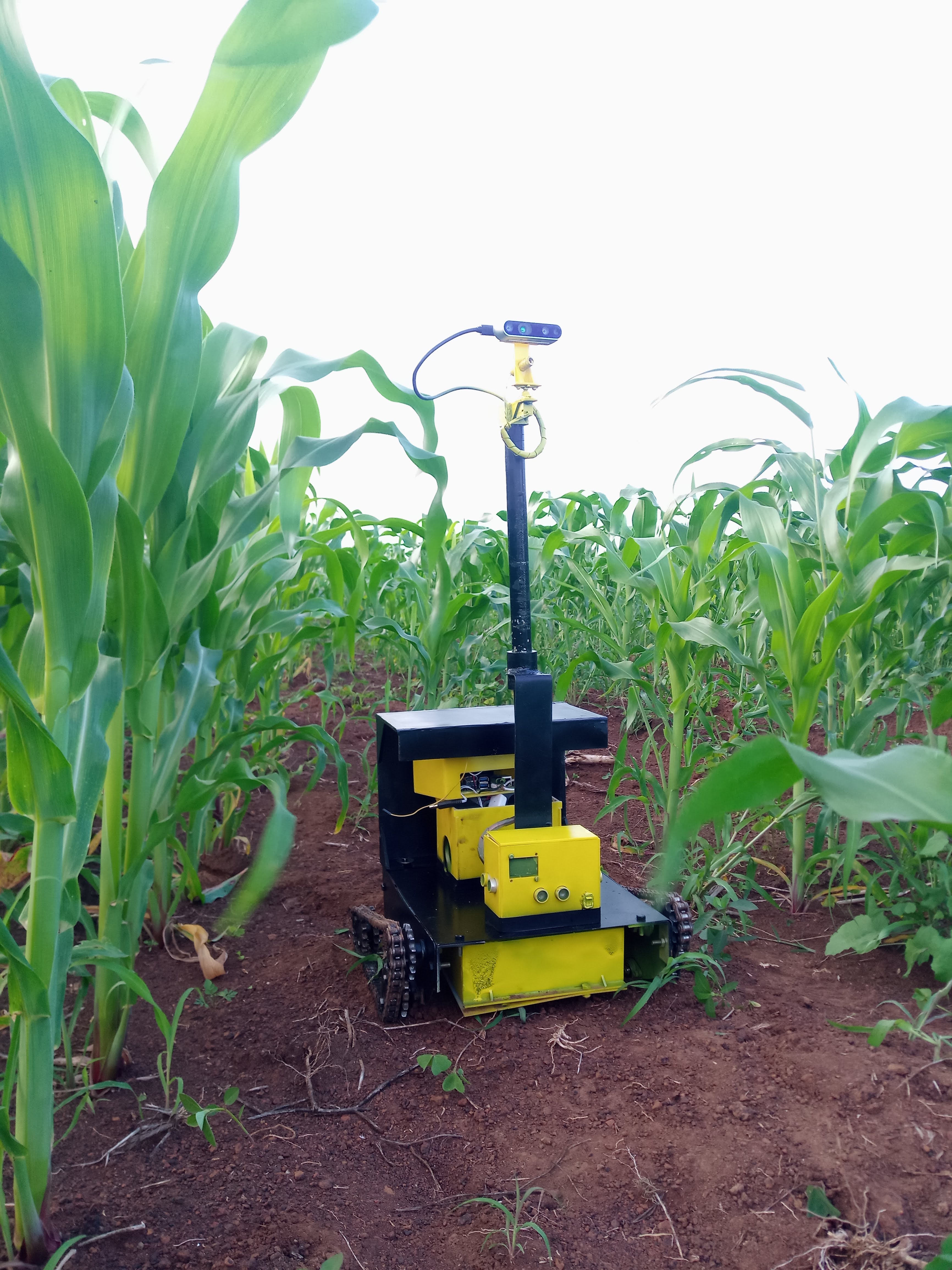 Full platform: tracked chassis, battery modules, sensor stack deployed in row